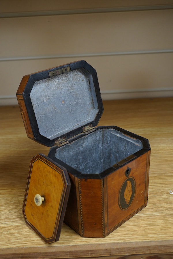 A George III Sheraton period octagonal West Indian satinwood and marquetry tea caddy, 12cm high. Condition - fair